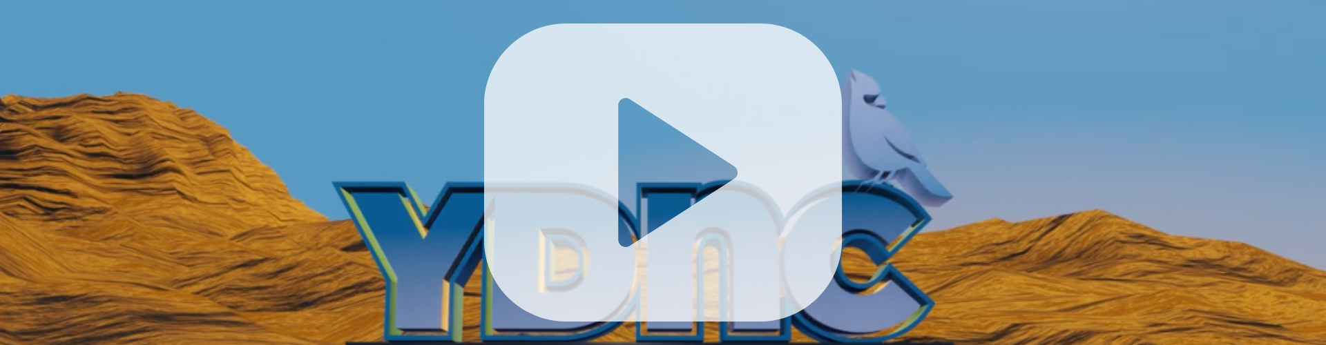 A screenshot of a YouTube video showing the YDNC Logo on a pedestal in a rocky landscape.
